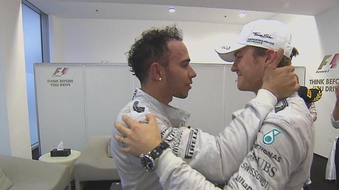 Gracious in defeat, Nico Rosberg congratulates his Mercedes team mate and season-long title rival Lewis Hamilton on becoming the 2014 Formula One world champion © FOWC Ltd. No reproduction without permission.