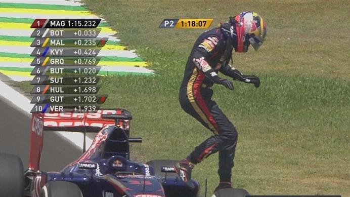 Jean-Eric Vergne jumps clear of his Toro Rosso after pulling to a halt at the side of the circuit, temporarily bringing out the red flags in FP2 © FOWC Ltd. No reproduction without permission.