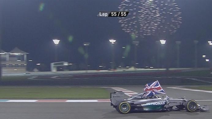 Flying the flag for Great Britain, Abu Dhabi racewinner and 2014 Formula One world champion Lewis Hamilton celebrates in the cockpit of his Mercedes © FOWC Ltd. No reproduction without permission.
