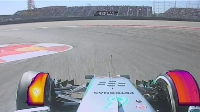 Mercedes' Lewis Hamilton locks up his front left tyre on his way to setting the early benchmark time in Q1 © FOWC Ltd. No reproduction without permission.