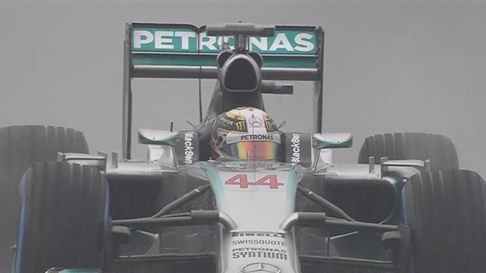 Lewis Hamilton goes fastest in his Mercedes on the blue-walled wet tyres after his first run in Q3. © FOWC Ltd