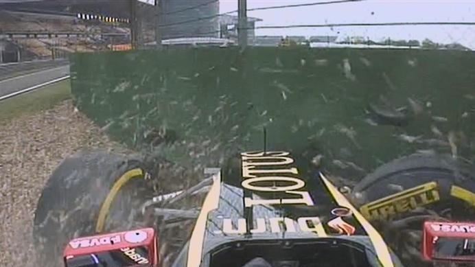 Pastor Maldonado misjudges his entry to the pit lane and crashes his Lotus into the barriers. © FOWC Ltd