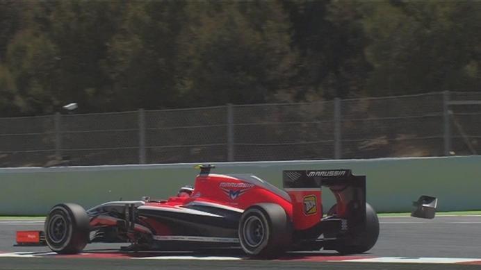 The 'monkey seat' rear wing flies off the back of Max Chilton's Marussia as he runs over the kerbs at Turn 16. © FOWC Ltd
