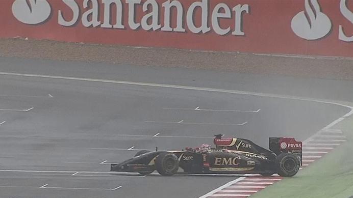 As conditions worsen, Romain Grosjean's Lotus slides sideways across the line. © FOWC Ltd
