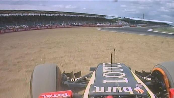 Romain Grosjean takes his Lotus through the gravel at Luffield. His comments over team radio suggest that he is struggling to control the car. © FOWC Ltd