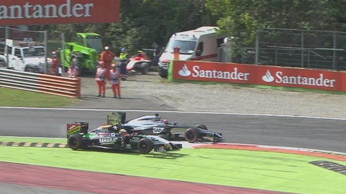 Force India's Sergio Perez and McLaren's Jenson Button are locked in an epic battle, with the Mexican finally gaining the advantage - albeit by slightly cutting the second chicane. © FOWC Ltd