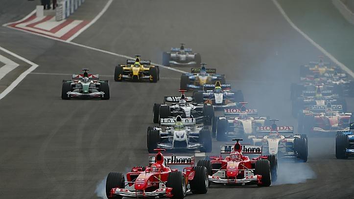 Michael Schumacher (GER) Ferrari F2004 and Rubens Barrichello (BRA) Ferrari F2004 both lock up at the start of the race. Formula One World Championship, Rd3, Bahrain Grand Prix, Race Day, Bahrain International Circuit, Bahrain, 4 April 2004 © Sutton Images. No reproduction without permission