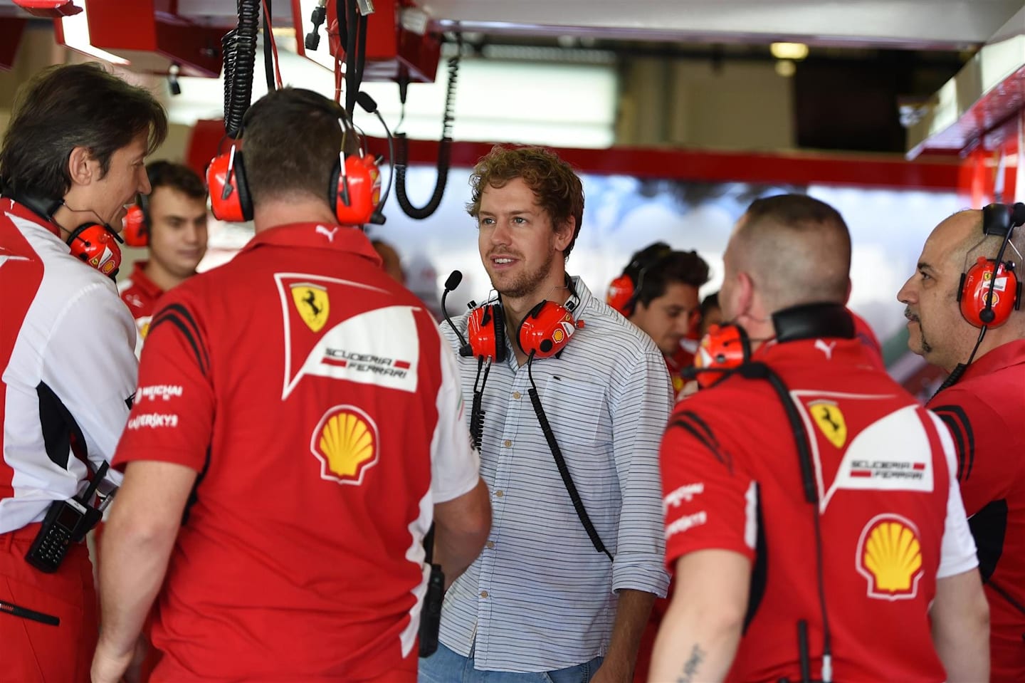 Sebastian Vettel (GER) Ferrari meets the Ferrari team members. Formula One Testing, Yas Marina Circuit, Abu Dhabi, UAE, Tuesday, 25 November 2014 © Sutton Images. No reproduction without permission