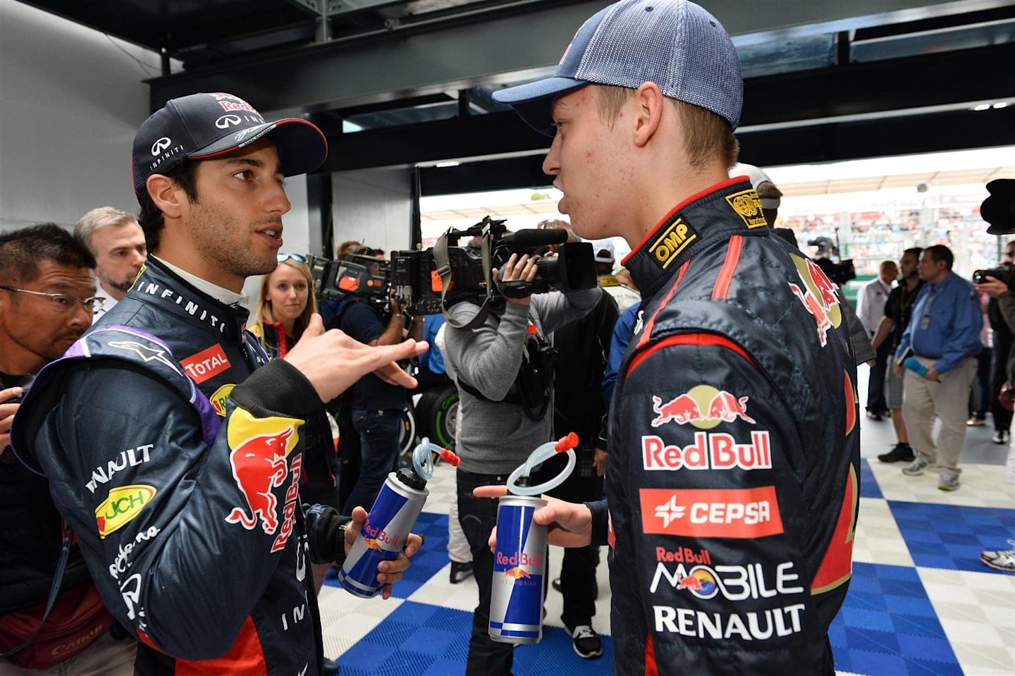 Daniel Ricciardo (AUS) Red Bull Racing and Daniil Kyvat (RUS) Scuderia Toro Rosso on the drivers parade. Formula One World Championship, Rd1, Australian Grand Prix, Race, Albert Park, Melbourne, Australia, Sunday, 16 March 2014. © Sutton Images