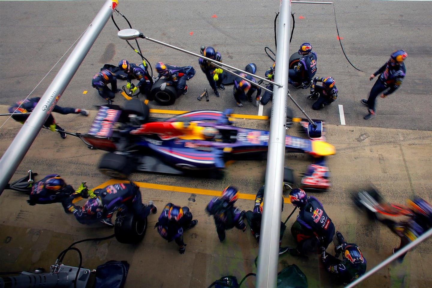 Sebastian Vettel (GER) Red Bull Racing RB10 makes a pit stop. Formula One World Championship, Rd5, Spanish Grand Prix, Race, Barcelona, Spain, Sunday, 11 May 2014