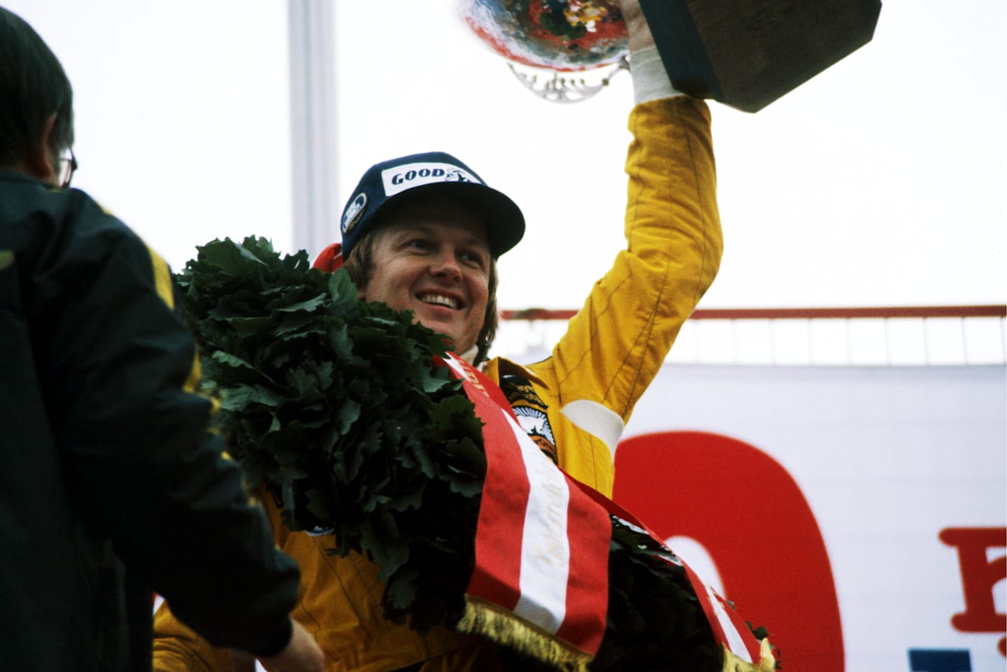 Ronnie Peterson (SWE) Lotus celebrates his win on the podium.  Austrian Grand Prix, Rd 12,