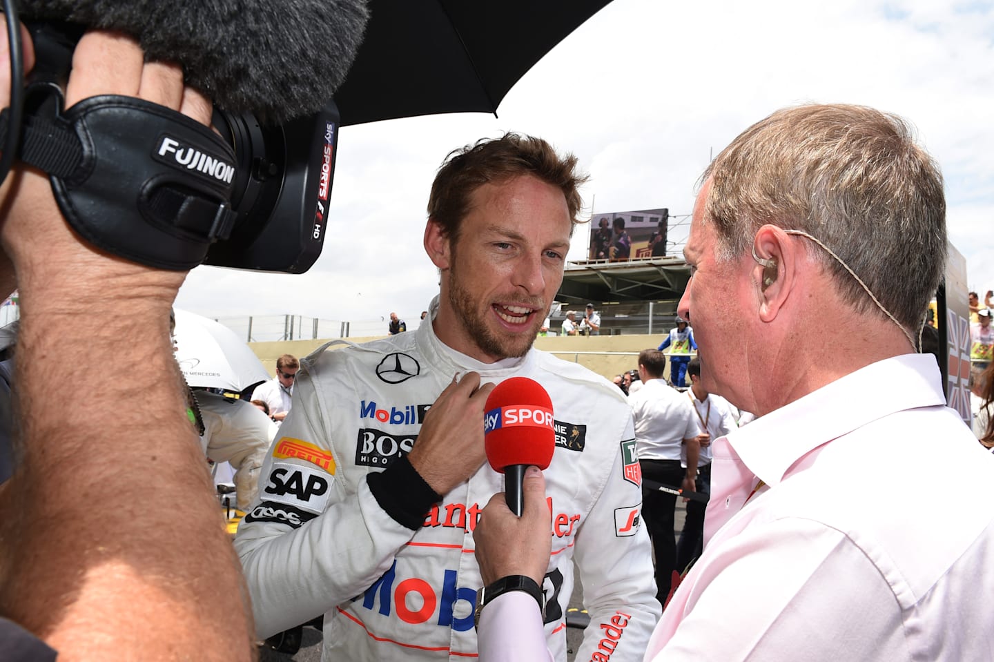 Jenson Button (GBR) McLaren and Martin Brundle (GBR) Sky TV on the grid. Formula One World Championship, Rd18, Brazilian Grand Prix, Race, Sao Paulo, Brazil, Sunday, 9 November 2014 