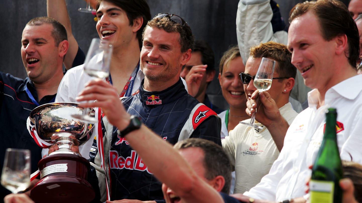 David Coulthard (GBR) Red Bull Racing celebrates the first podium for Red Bull Racing with the