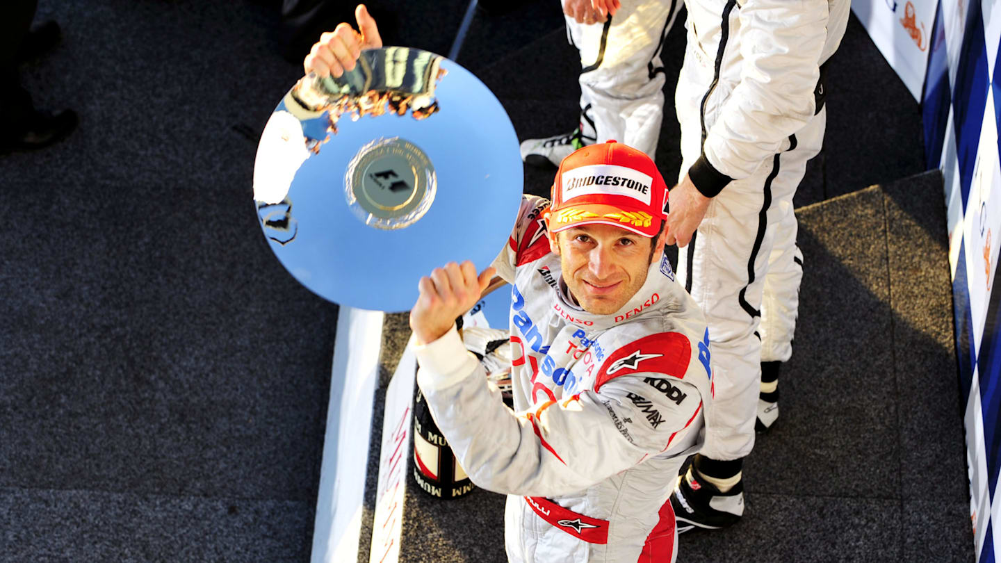 Jarno Trulli (ITA) Toyota celebrates his third position on the podium. Formula One World