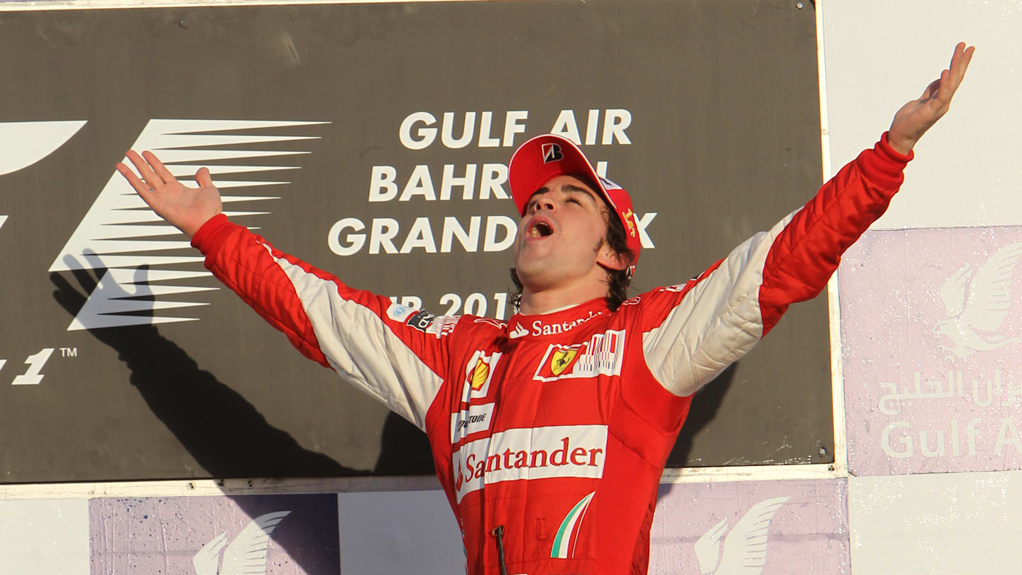 Race winner Fernando Alonso (ESP) Ferrari on the podium.  Formula One World Championship, Rd 1,