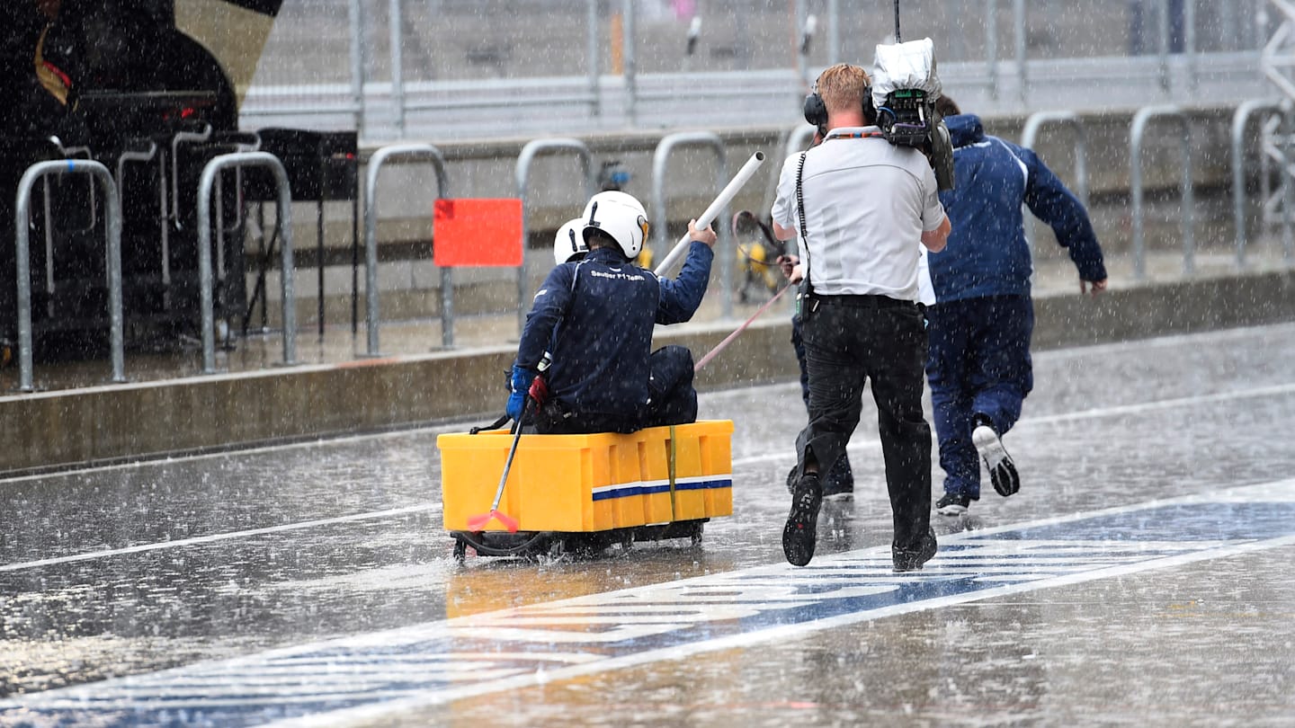 Sauber mechanics with an improvised rowing boat in pit lane at Formula One World Championship,