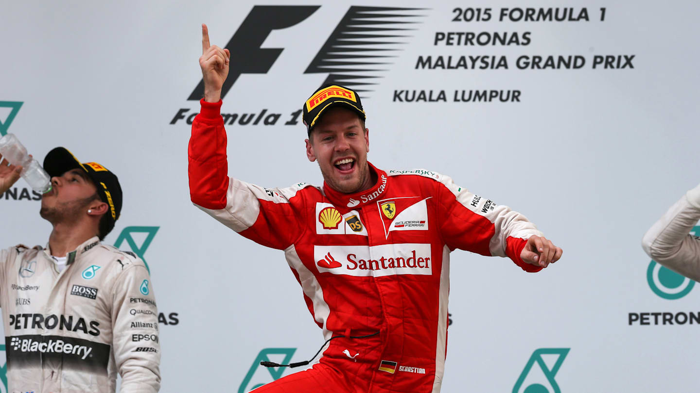 Race winner Sebastian Vettel (GER) Ferrari celebrates on the podium at Formula One World