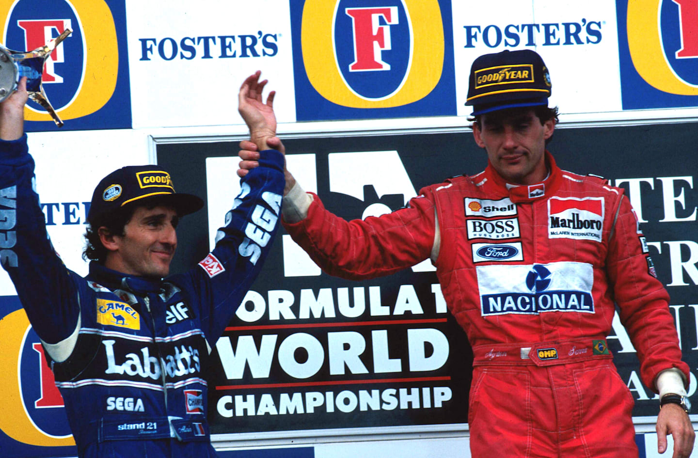 Race winner Ayrton Senna (BRA) McLaren (right) acknowledges second place finisher and World