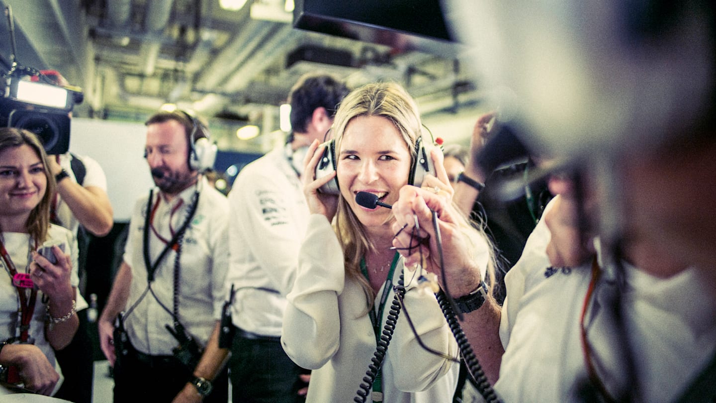 Wife Vivian in the garage ©  Mercedes-Benz Grand Prix Ltd / Paul Ripke