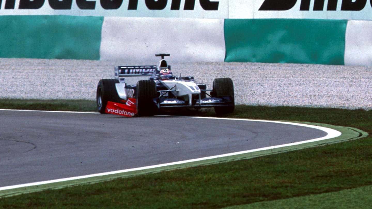 Juan Pablo Montoya (COL) BMW Williams FW24 runs wide after being hit by Michael Schumacher (GER)