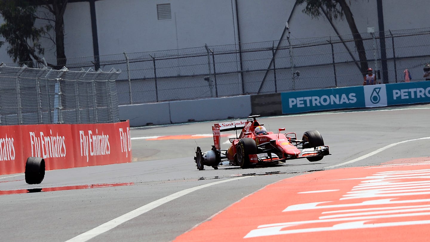 www.sutton-images.com  Sebastian Vettel (GER) Ferrari SF15-T with a puncture on lap one at