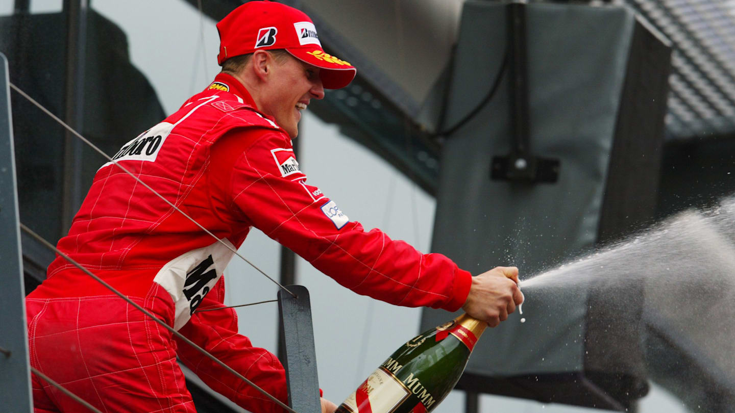 Michael Schumacher (GER) Ferrari celebrates his victory on the podium. Australian Grand Prix, Race