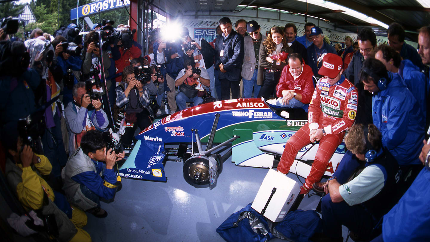 Rubens Barrichello (BRA) Jordan sits in the garage surrounded by the media during Qualifying having