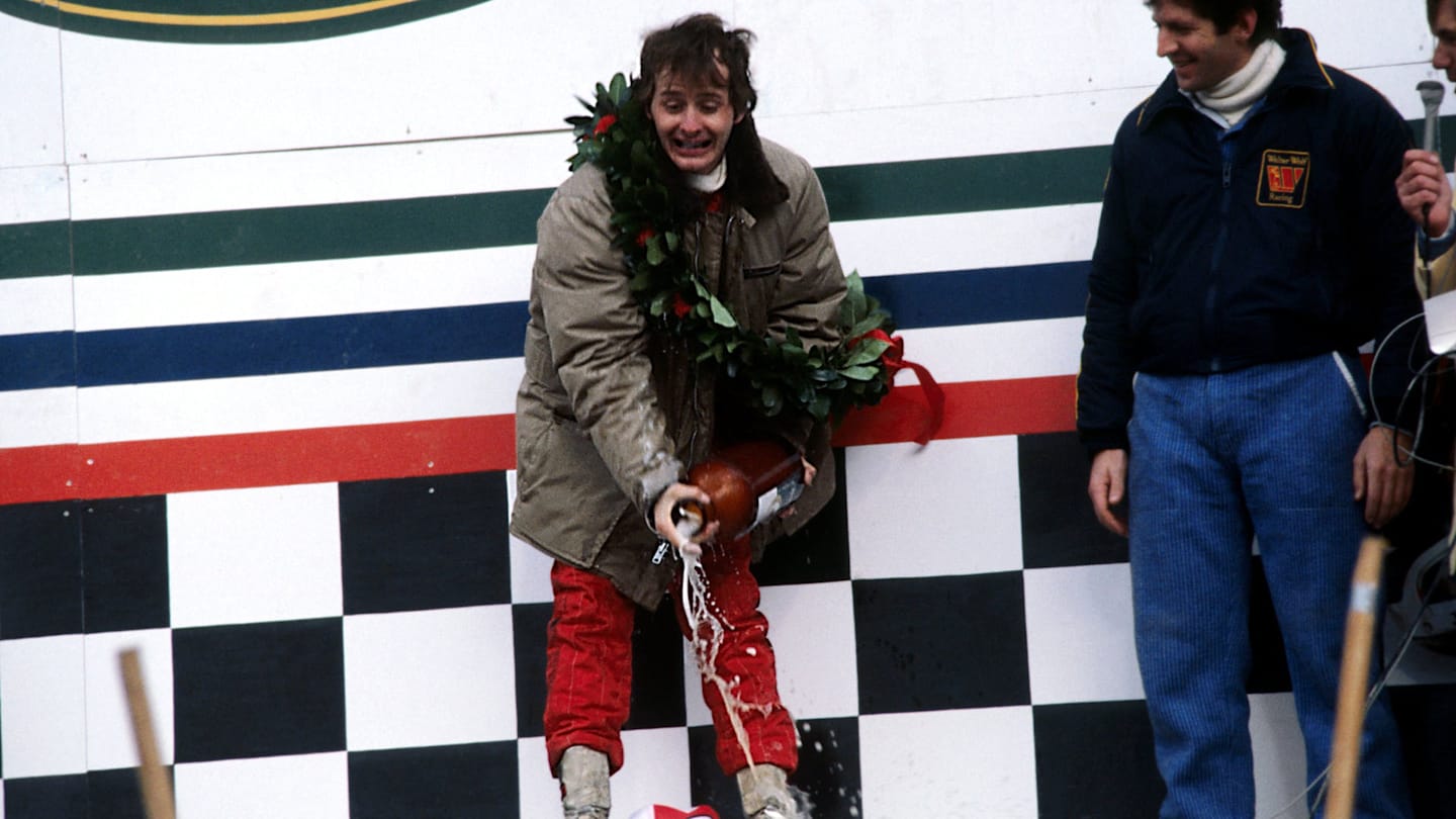 Gilles Villeneuve (CDN) Ferrari (Left) celebrates his maiden GP victory on the podium by spraying