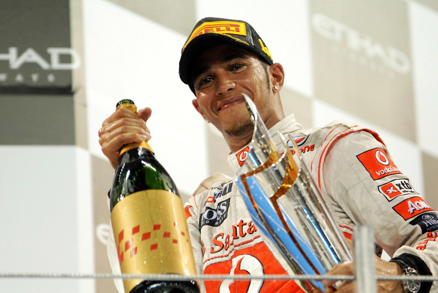 Race winner Lewis Hamilton (GBR) McLaren celebrates on the podium.  Formula One World