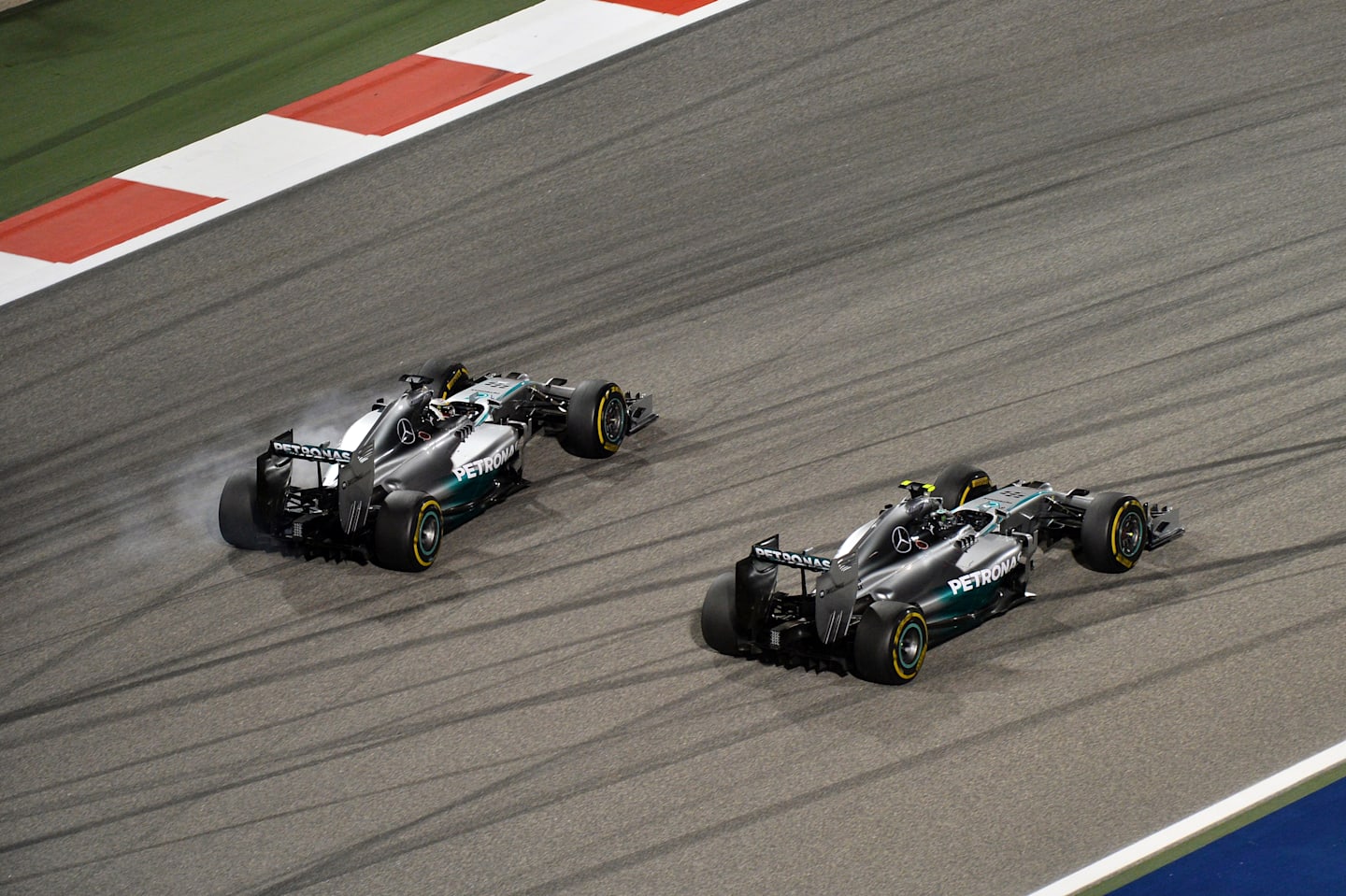 Nico Rosberg (GER) Mercedes AMG F1 W05 leads Lewis Hamilton (GBR) Mercedes AMG F1 W05. Formula One World Championship, Rd3, Bahrain Grand Prix, Race, Bahrain International Circuit, Sakhir, Bahrain, Sunday, 6 April 2014