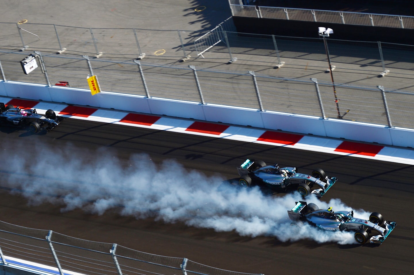 Nico Rosberg (GER) Mercedes AMG F1 W05 locks up inside Lewis Hamilton (GBR) Mercedes AMG F1 W05 at the start of the race. Formula One World Championship, Rd16, Russian Grand Prix, Race, Sochi Autodrom, Sochi, Krasnodar Krai, Russia, Sunday, 12 October 2014