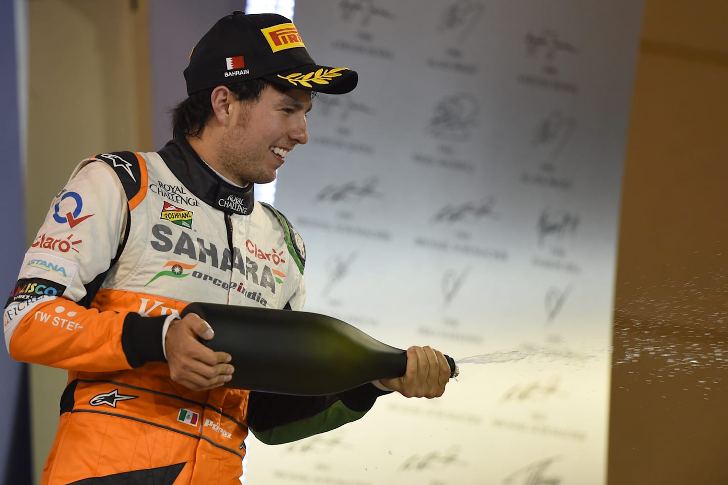 Sergio Perez (MEX) Force India celebrates on the podium. Formula One World Championship, Rd3, Bahrain Grand Prix, Race, Bahrain International Circuit, Sakhir, Bahrain, Sunday, 6 April 2014