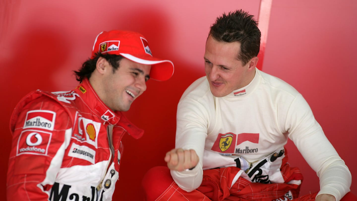 Michael Schumacher (GER) Ferrari, chats with team mate Felipe Massa (BRA) Ferrari.  Formula One