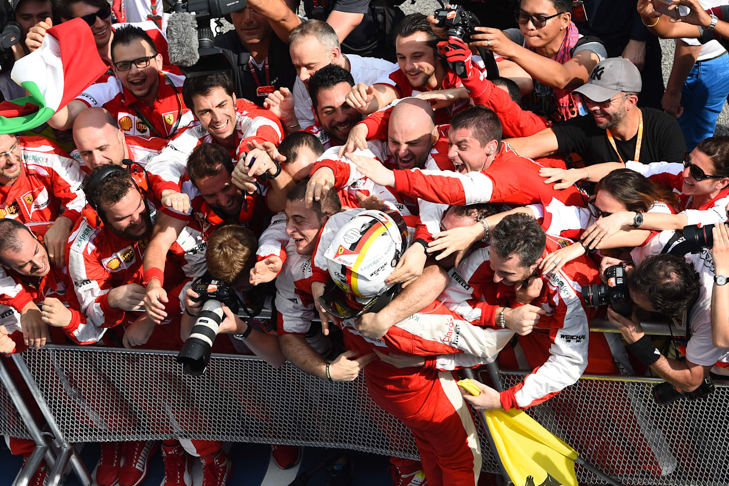 Sebastian Vettel (GER) Ferrari celebrates victory in Parc Ferme at Formula One World Championship,