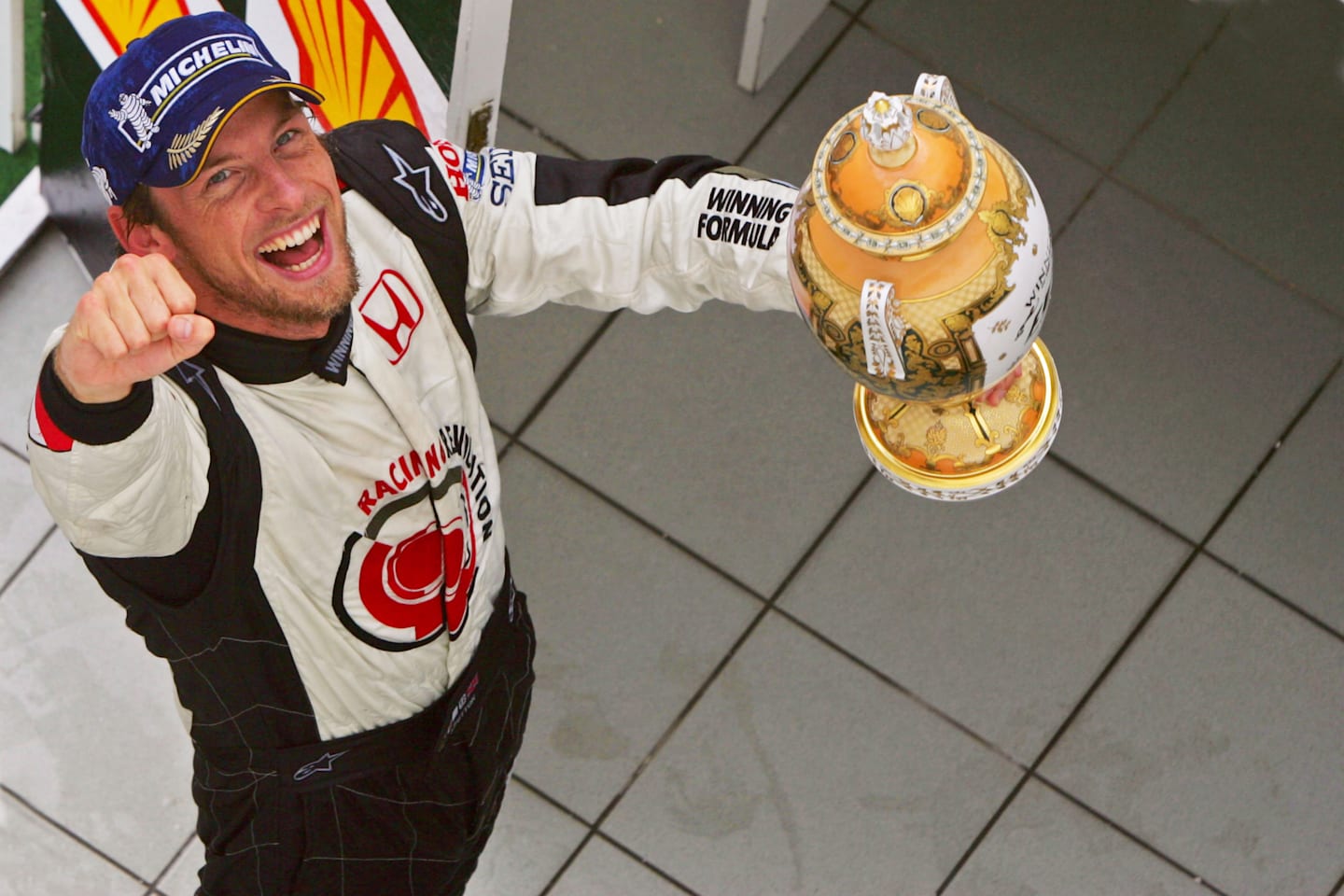 Race winner Jenson Button (GBR) Honda Racing RA106 celebrates on the podium. Formula One World