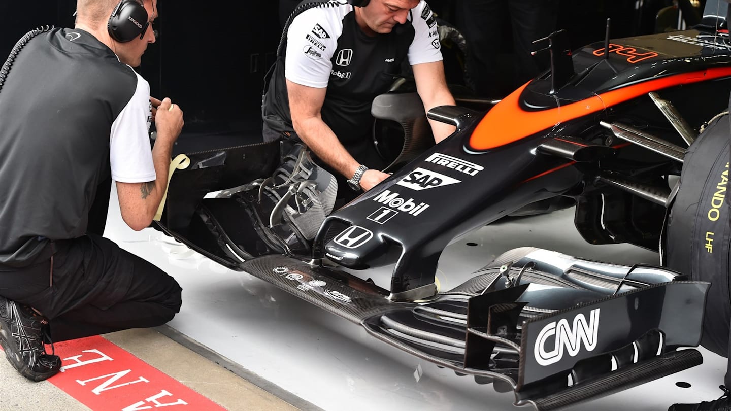 McLaren MP4-30 nose and front wing and mechanics at Formula One World Championship, Rd8, Austrian