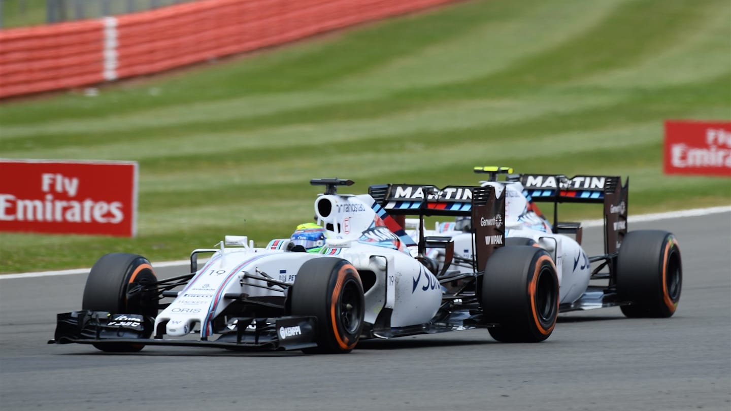 Felipe Massa (BRA) Williams FW37 battles with Valtteri Bottas (FIN) Williams FW37 at Formula One