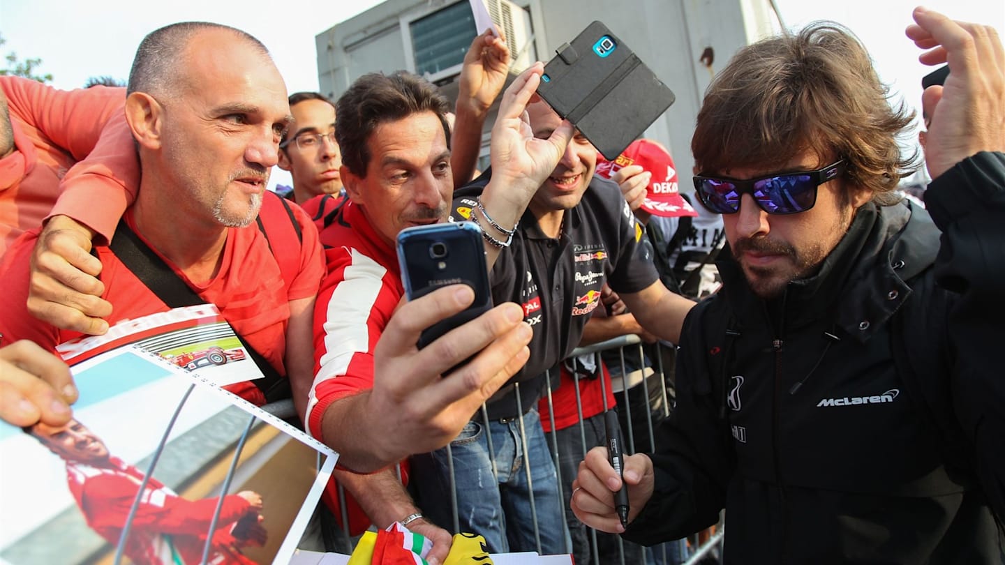 Fernando Alonso (ESP) McLaren signs autographs for the fans at Formula One World Championship,