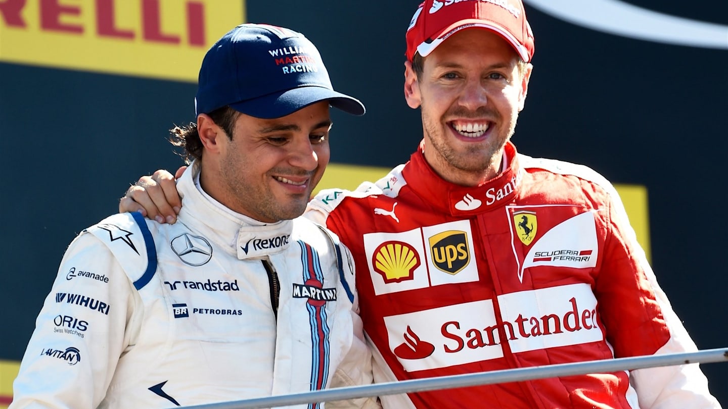 Sebastian Vettel (GER) Ferrari and Felipe Massa (BRA) Williams celebrate on the podium at Formula