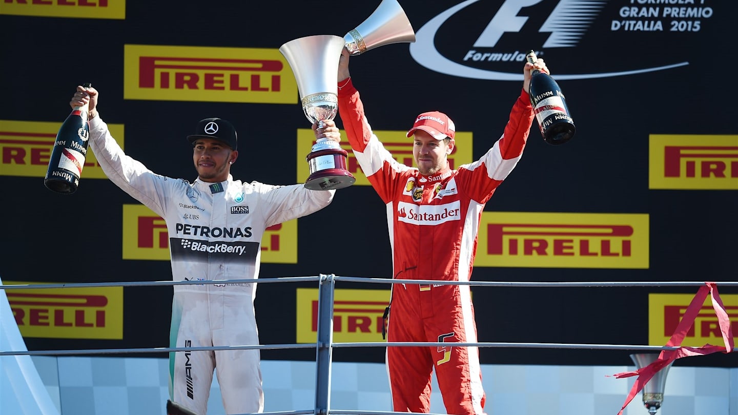 Race winner Lewis Hamilton (GBR) Mercedes AMG F1 and Sebastian Vettel (GER) Ferrari celebrate on the podium with the trophies at Formula One World Championship, Rd12, Italian Grand Prix, Race, Monza, Italy, Sunday 6  September 2015. © Sutton Motorsport Images