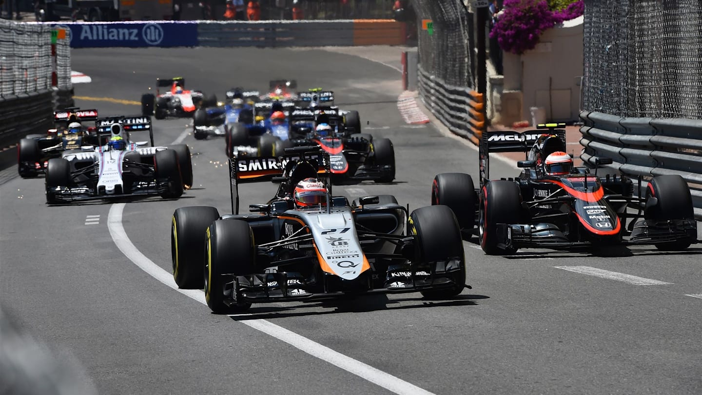 Nico Hulkenberg (GER) Force India VJM08 and Jenson Button (GBR) McLaren MP4-30 battling at the