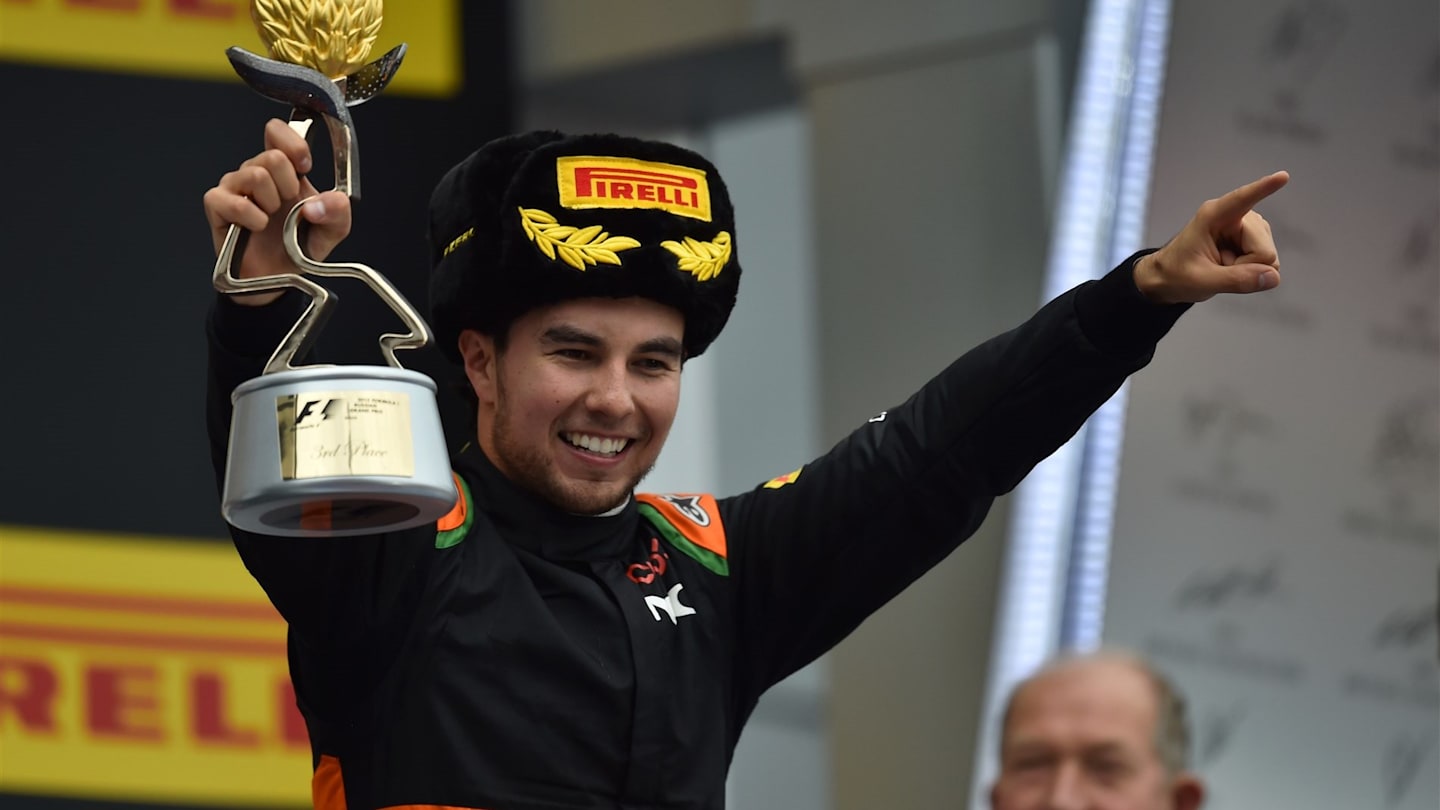 Sergio Perez (MEX) Force India celebrates on the podium with the trophy at Formula One World