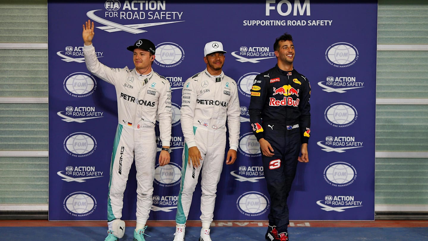 (L to R): Nico Rosberg (GER) Mercedes AMG F1, pole sitter Lewis Hamilton (GBR) Mercedes AMG F1 and Daniel Ricciardo (AUS) Red Bull Racing celebrate in parc ferme at Formula One World Championship, Rd21, Abu Dhabi Grand Prix, Qualifying, Yas Marina Circuit, Abu Dhabi, UAE, Saturday 26 November 2016. © Sutton Images