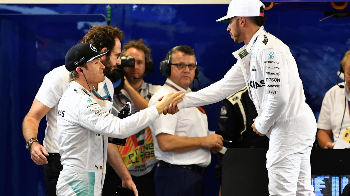 Lewis Hamilton (GBR) Mercedes AMG F1 and Nico Rosberg (GER) Mercedes AMG F1 celebrate and shakehands in parc ferme at Formula One World Championship, Rd21, Abu Dhabi Grand Prix, Qualifying, Yas Marina Circuit, Abu Dhabi, UAE, Saturday 26 November 2016. © Sutton Images