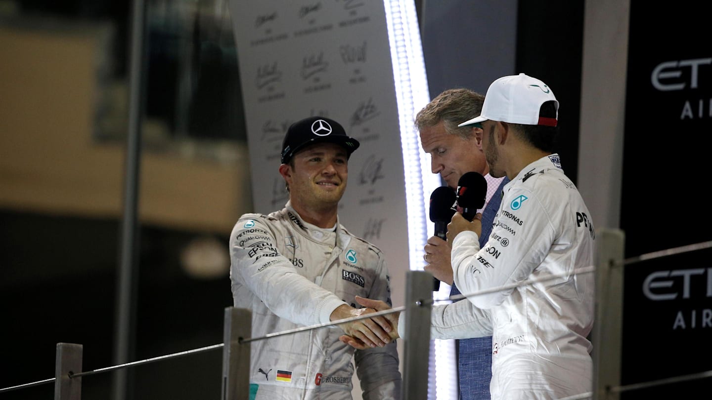 David Coulthard (GBR) Channel Four TV Commentator, World Champion Nico Rosberg (GER) Mercedes AMG F1 and race winner Lewis Hamilton (GBR) Mercedes AMG F1 celebrate on the podium and shake hands at Formula One World Championship, Rd21, Abu Dhabi Grand Prix, Race, Yas Marina Circuit, Abu Dhabi, UAE, Sunday 27 November 2016. © Sutton Images