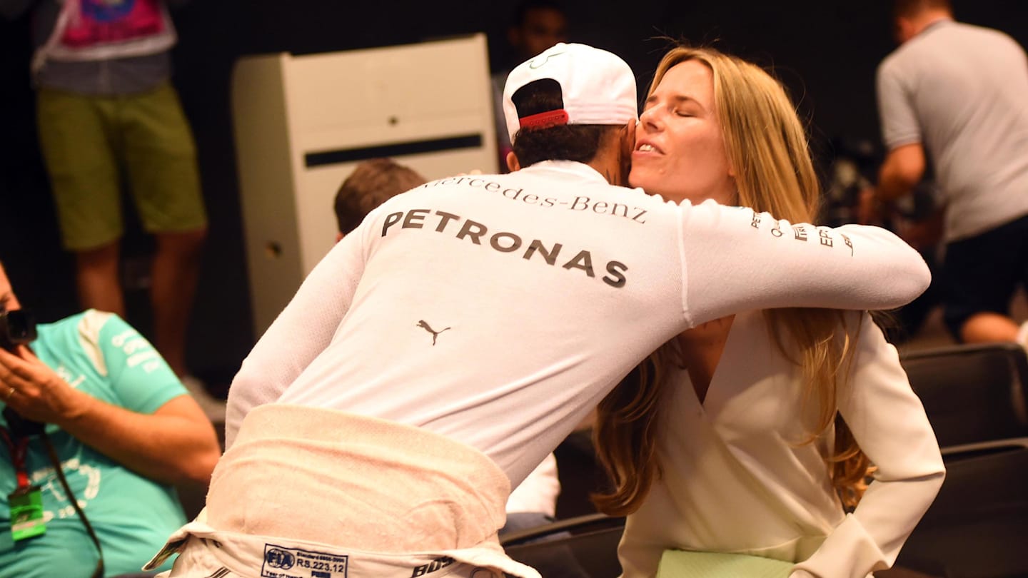 Vivian Rosberg (GER) wife of Nico Rosberg (GER) Mercedes AMG F1 is congratulated by Lewis Hamilton (GBR) Mercedes AMG F1 at the Press Conference at Formula One World Championship, Rd21, Abu Dhabi Grand Prix, Race, Yas Marina Circuit, Abu Dhabi, UAE, Sunday 27 November 2016. © Sutton Images