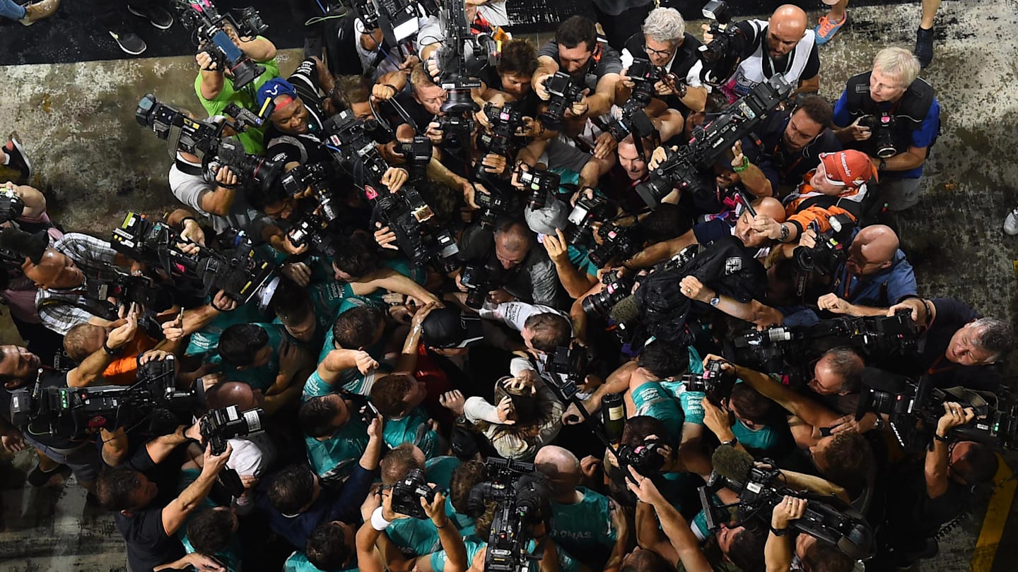 Nico Rosberg (GER) Mercedes AMG F1 celebrates with the team surrounded by photographers at Formula One World Championship, Rd21, Abu Dhabi Grand Prix, Race, Yas Marina Circuit, Abu Dhabi, UAE, Sunday 27 November 2016. © Sutton Images