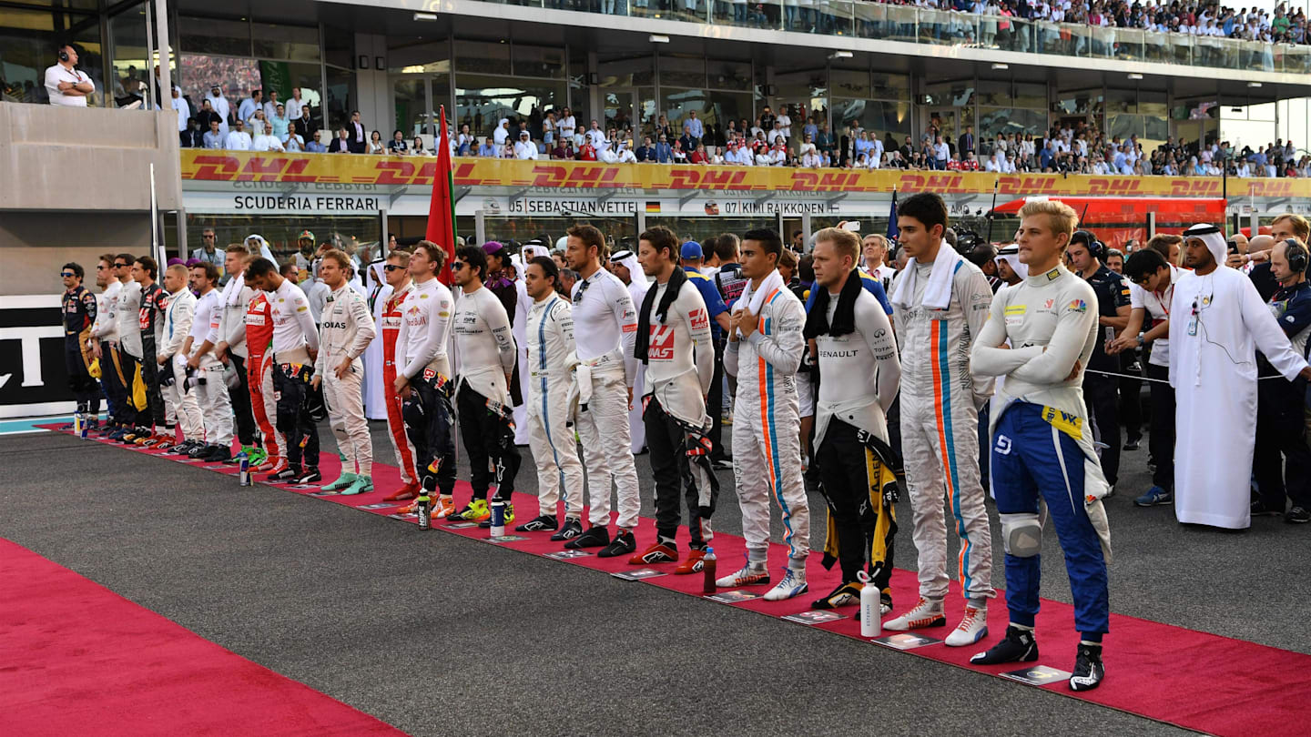 Drivers observe the National Anthem on the grid at Formula One World Championship, Rd21, Abu Dhabi Grand Prix, Race, Yas Marina Circuit, Abu Dhabi, UAE, Sunday 27 November 2016. © Sutton Images