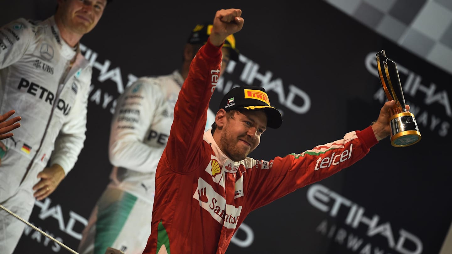 Sebastian Vettel (GER) Ferrari celebrates on the podium with the trophy at Formula One World Championship, Rd21, Abu Dhabi Grand Prix, Race, Yas Marina Circuit, Abu Dhabi, UAE, Sunday 27 November 2016. © Sutton Images