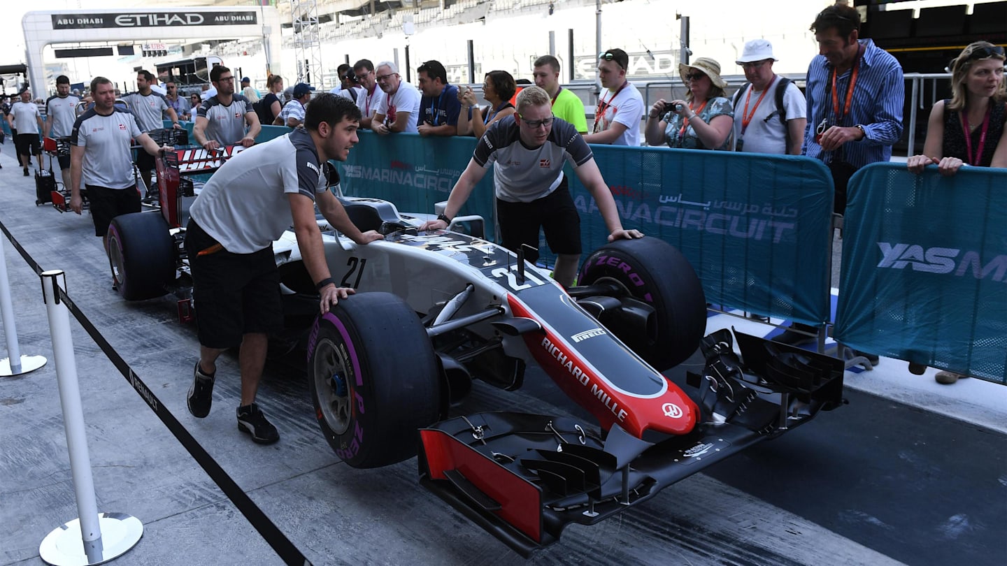 Haas mechanics with Haas VF-16 in pit lane at Formula One World Championship, Rd21, Abu Dhabi Grand Prix, Preparations, Yas Marina Circuit, Abu Dhabi, UAE, Thursday 24 November 2016. © Sutton Images